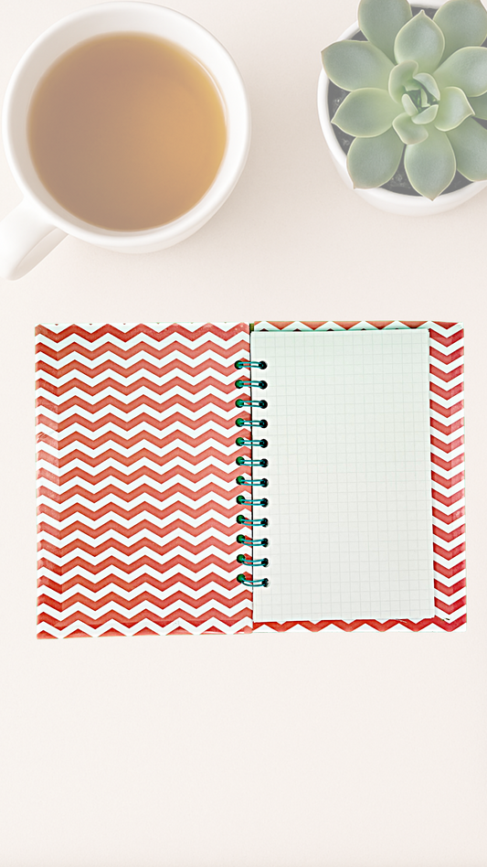Open notebook with red chevron pattern on the inside cover