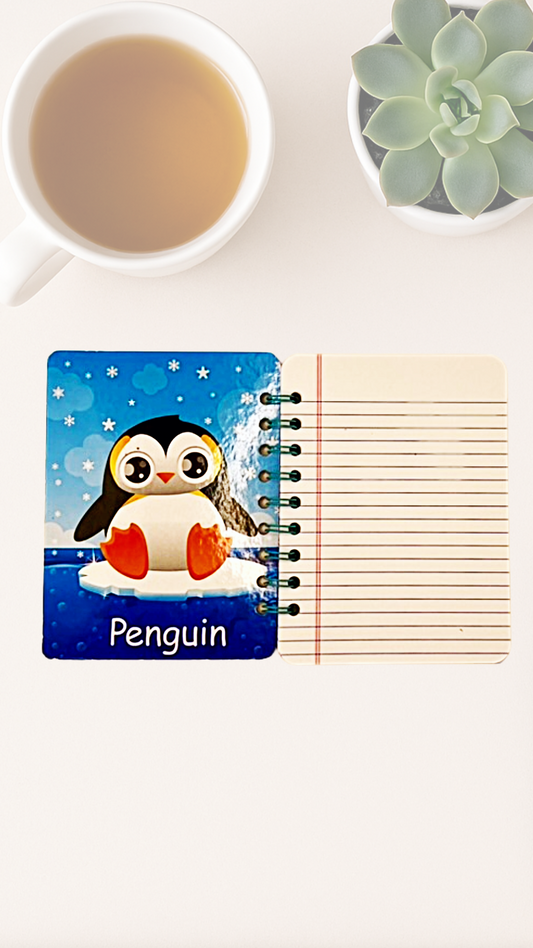 Open notebook with illustrated penguin design the inside cover