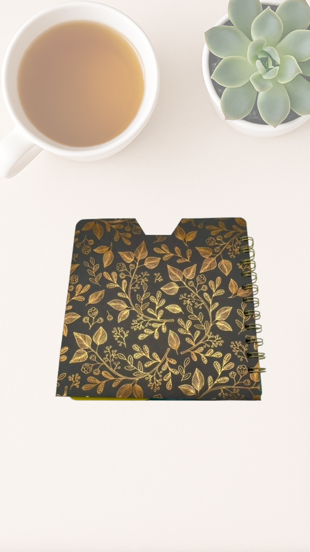 Notebook with blue and gold floral pattern back cover