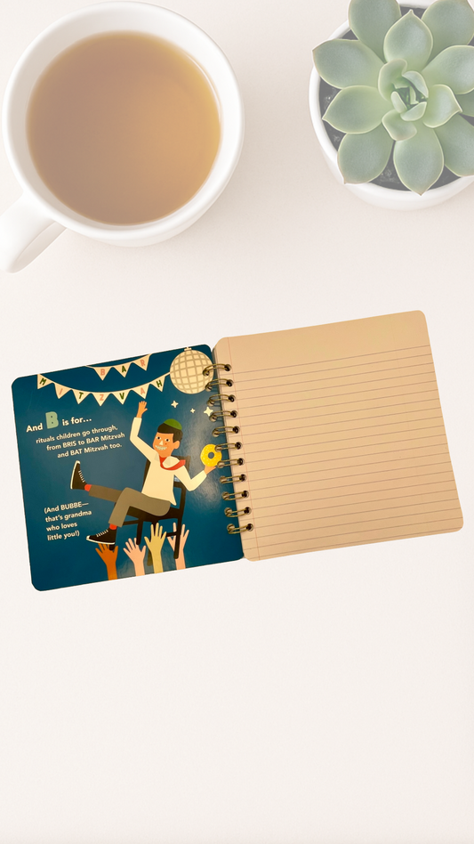 Notebook with a colorful inside cover illustration that says B is for Bar Mitzvah