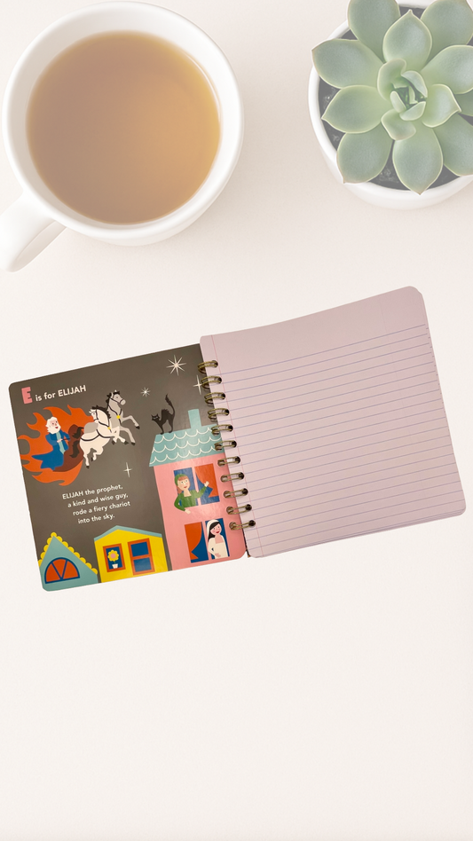 Open notebook with colorful illustrations on a white surface next to a cup of tea and a succulent plant.