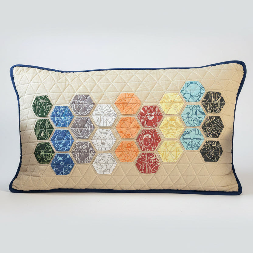 Hexagon patterned pillow on a brown chair