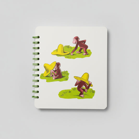 Curious George tries on a big yellow hat