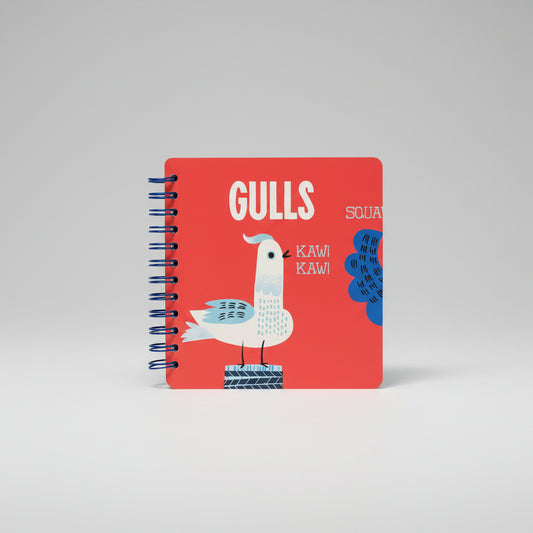Notebook with a red cover featuring a gull illustration on a beige background