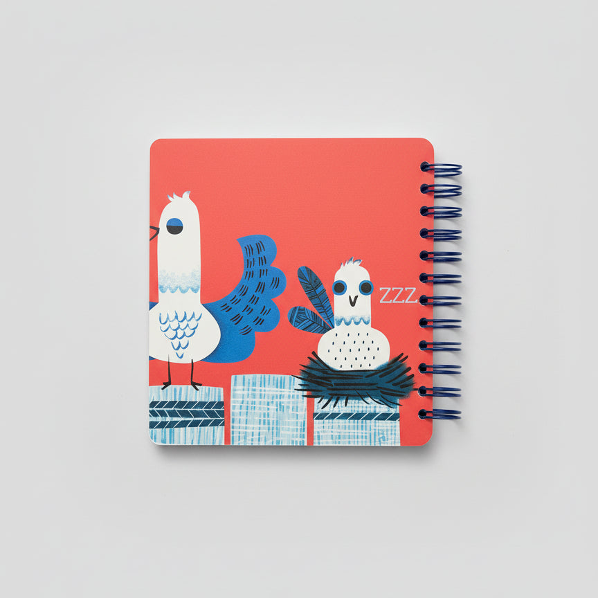 Notebook with bird illustration on a red background