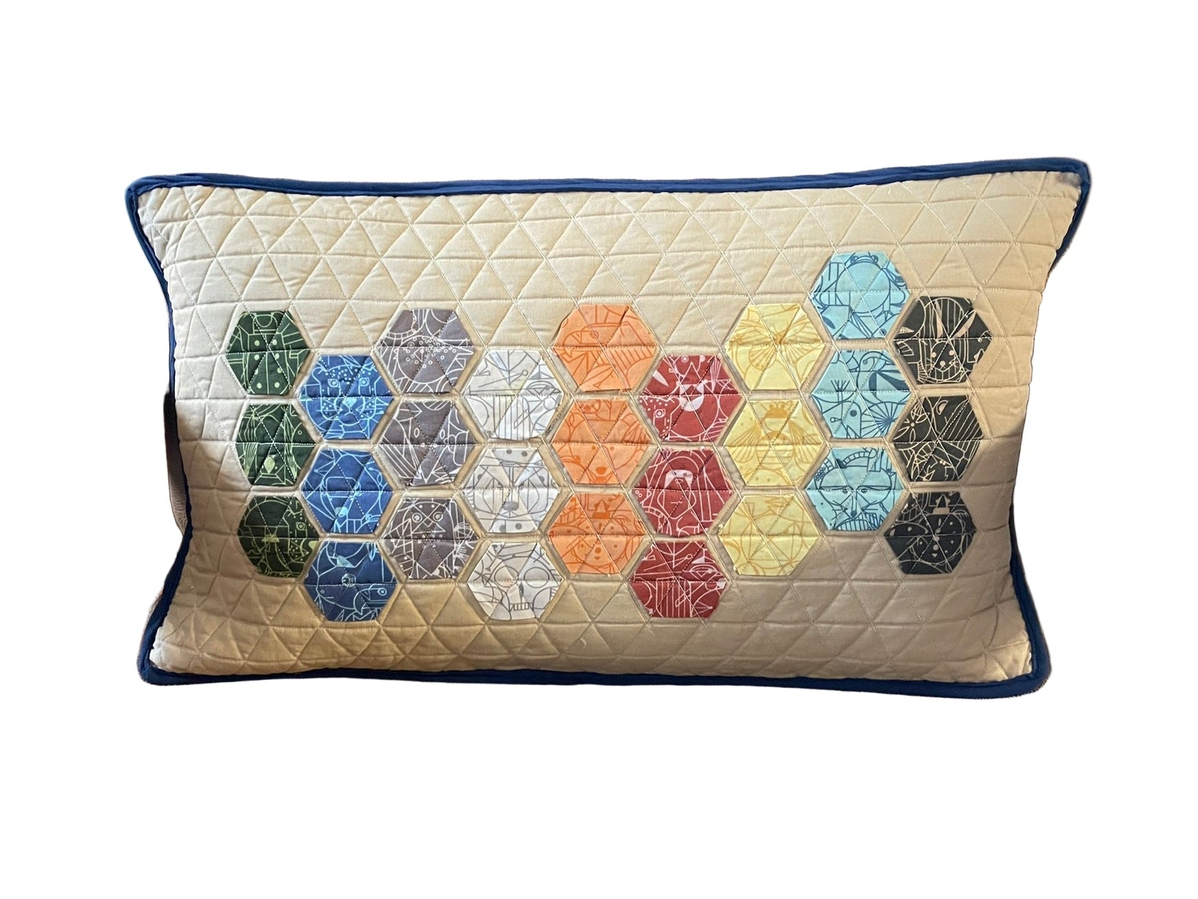 Hexagon patterned pillow on a brown chair