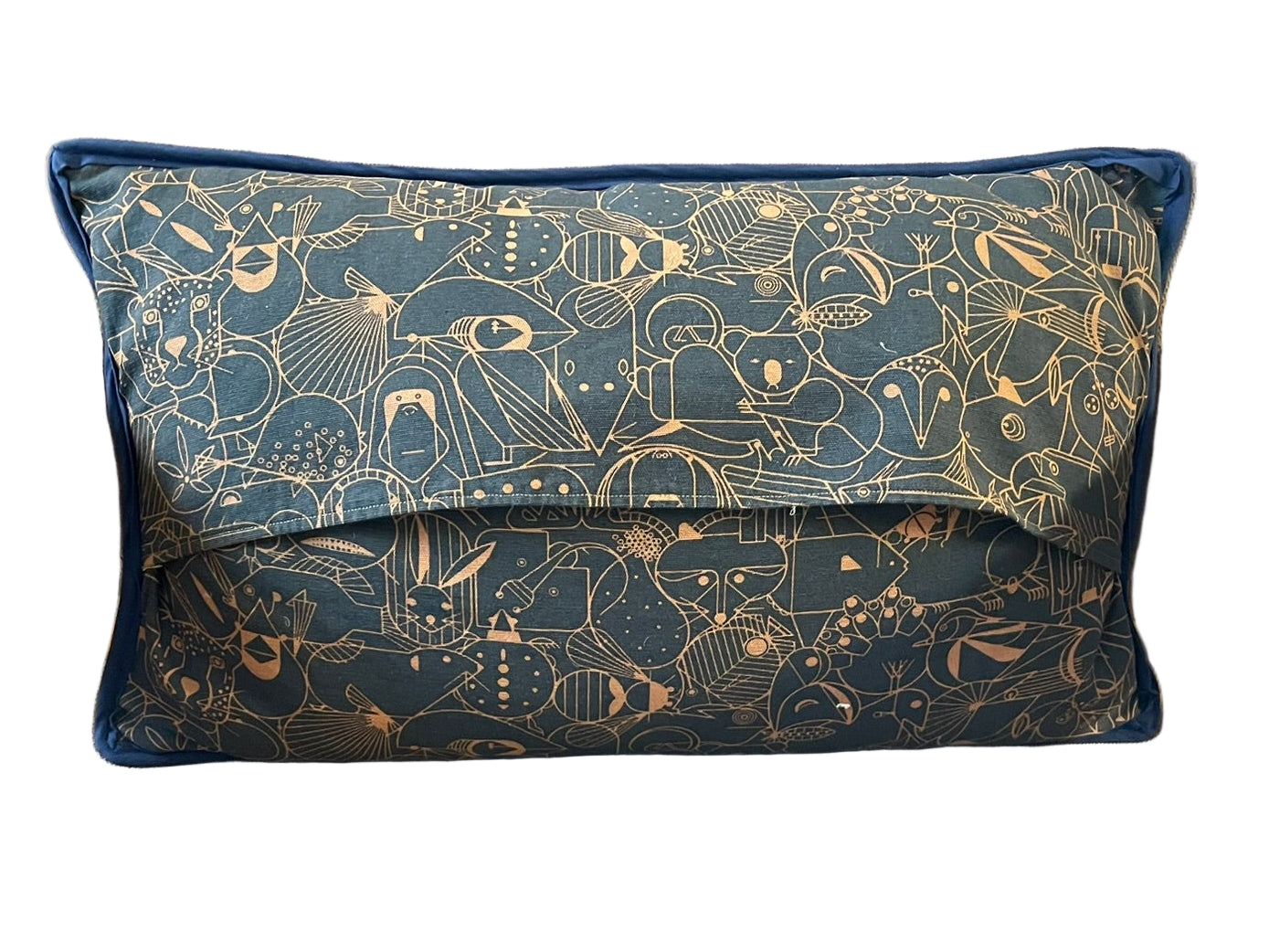 Decorative pillow with animal pattern on a brown chair