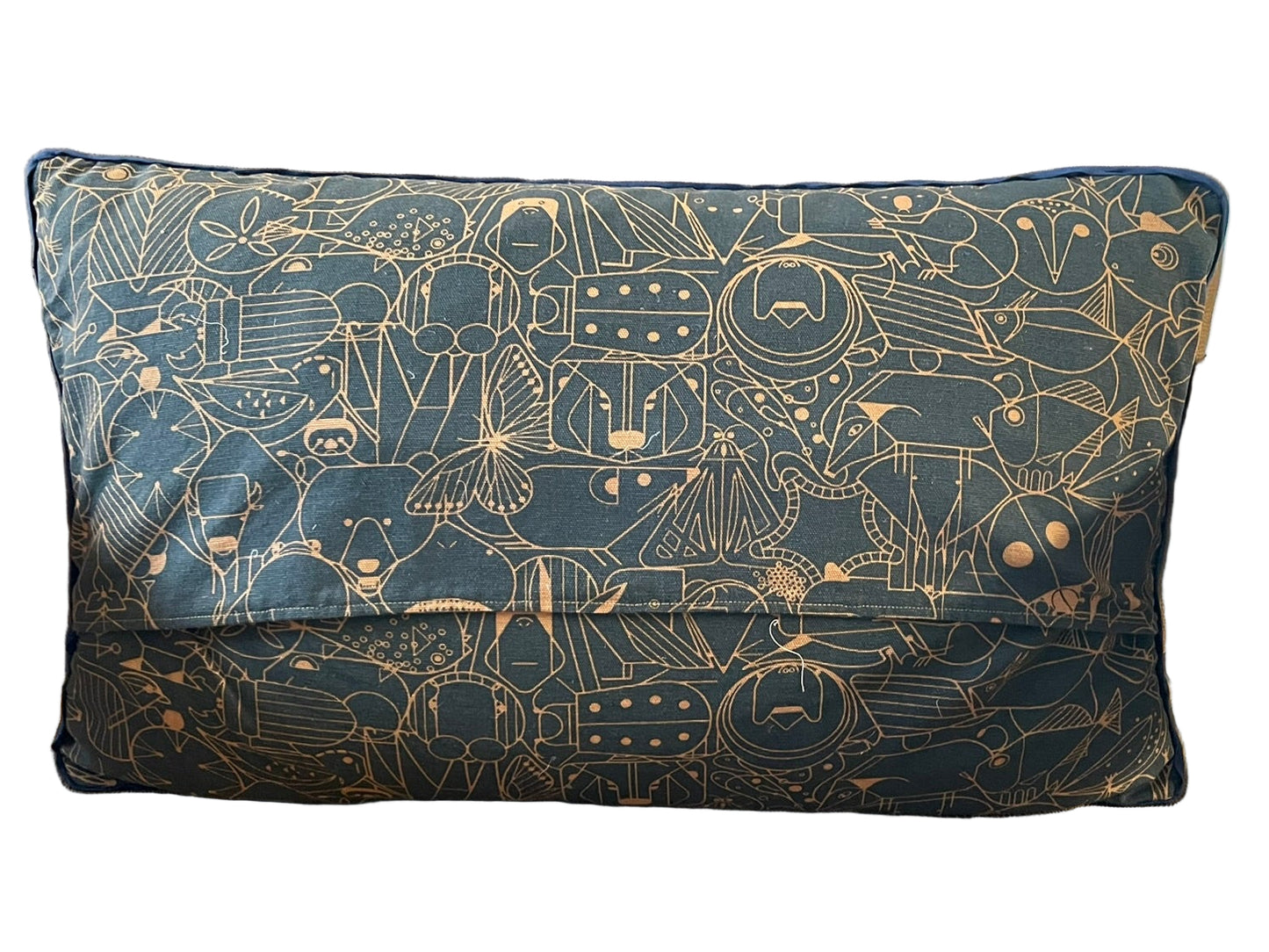 Decorative pillow with celestial pattern on a beige chair