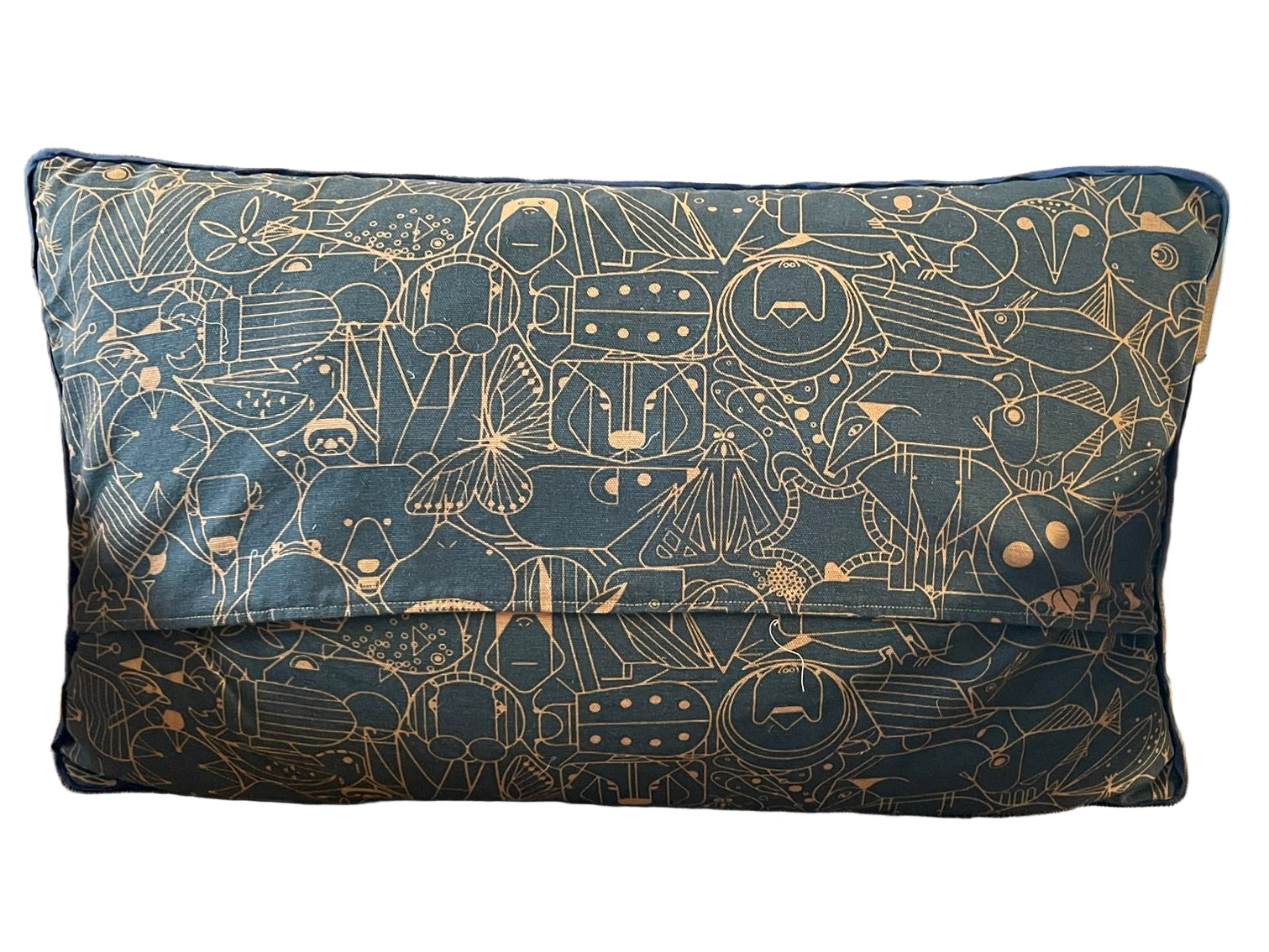 Decorative pillow with celestial pattern on a beige chair