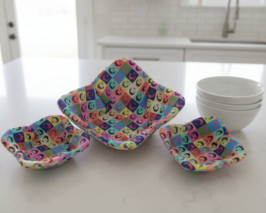 Colorful patterned with Ron Swanson-style fabric bowl cozies