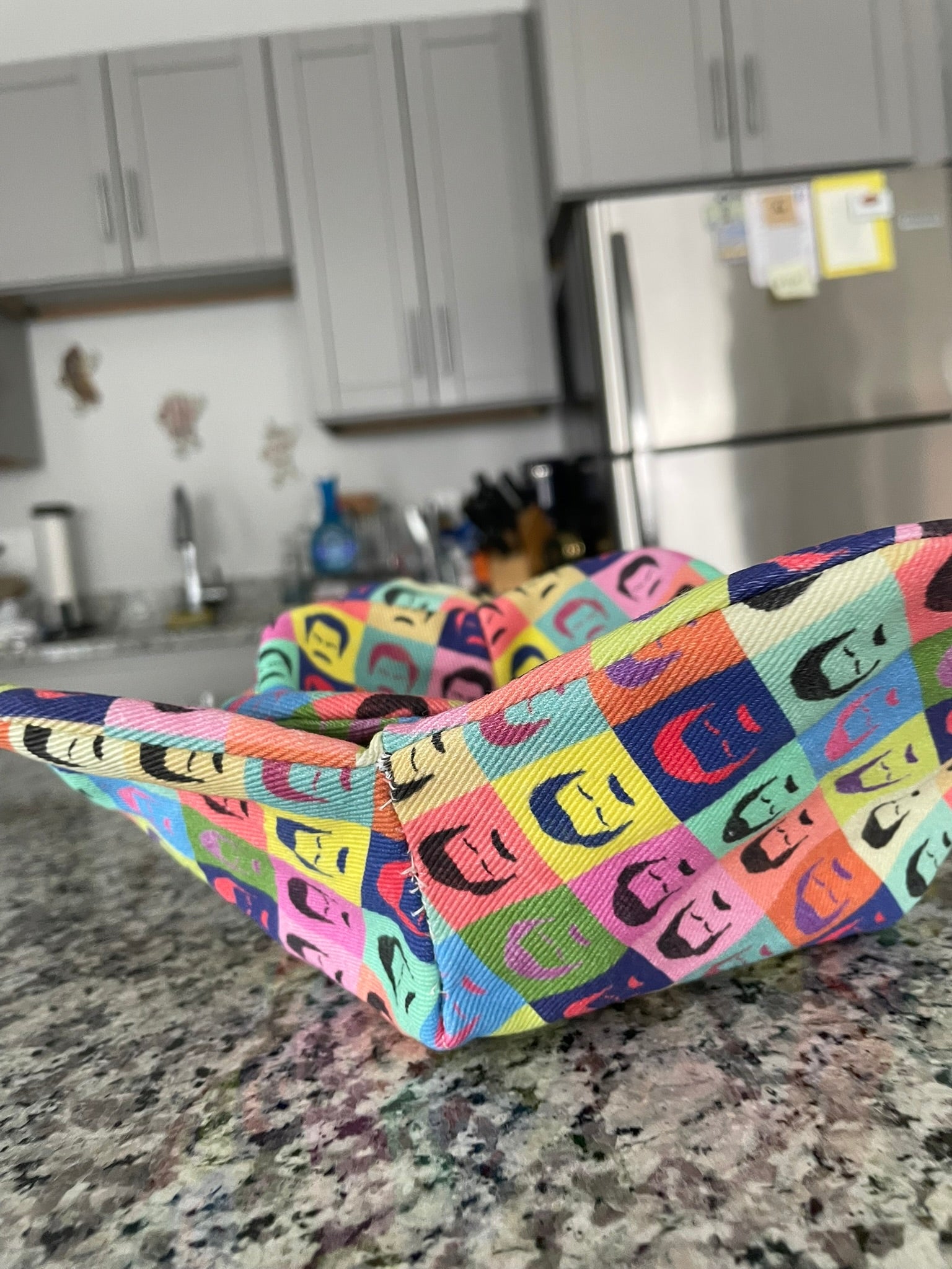 Ron Swanson inspired fabric bowl cozies stacked on a kitchen counter