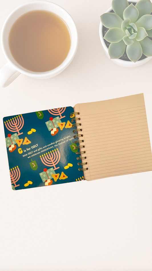 Notebook with colorful inside cover design that says G is for Gelt