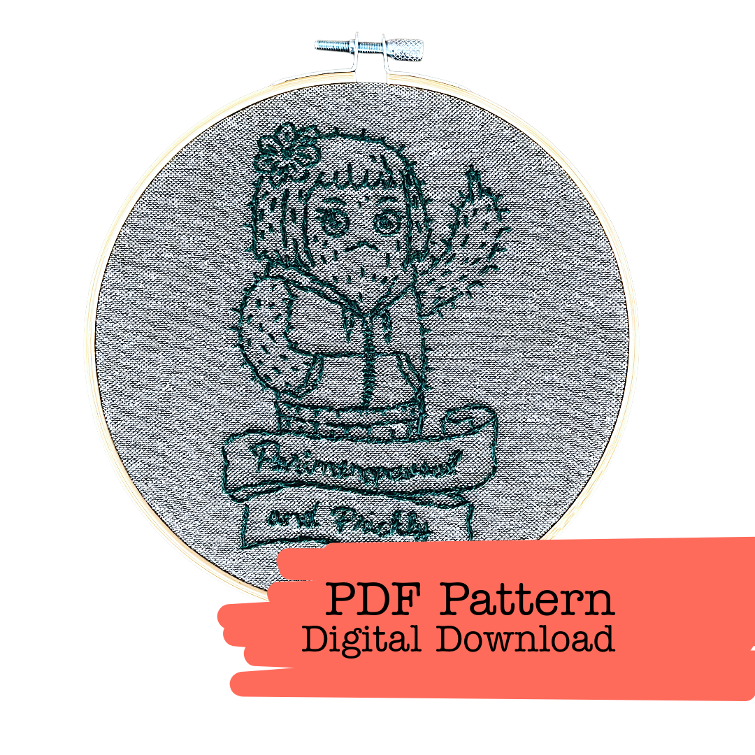 Embroidery hoop with a cartoon character design and text 'Persevered and Picked' on gray fabric, with a red banner at the bottom indicating a digital download option.