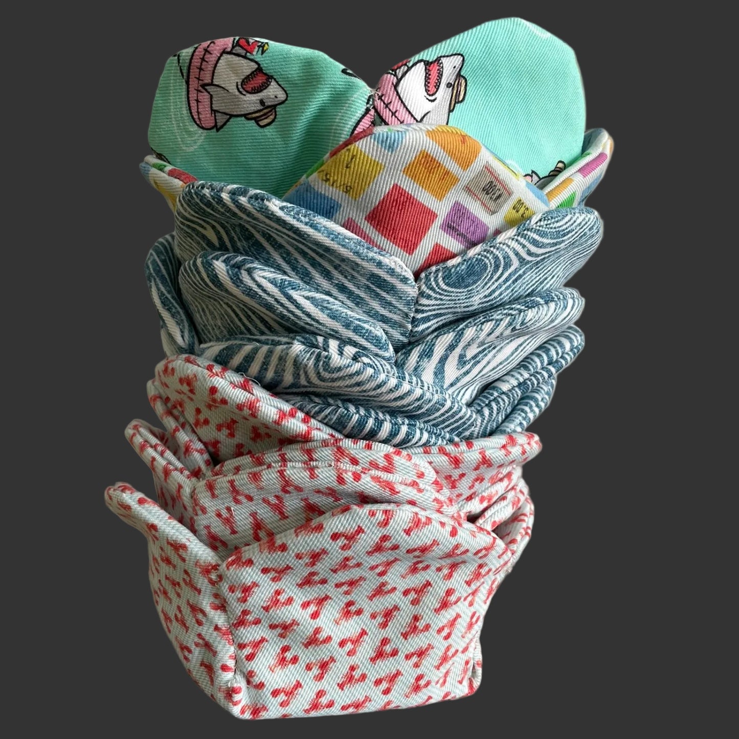 Stack of patterned fabric baskets on a kitchen counter